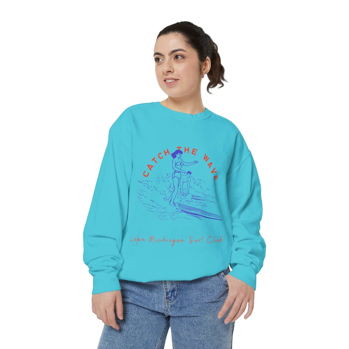 Unisex sweatshirt with "Catch The Wave" design, Lake Michigan Surf Club, in blue.