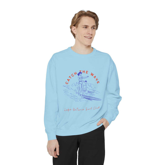 Unisex sweatshirt with "Catch The Wave" Lake Ontario Surf Club design, featuring a relaxed fit and luxurious comfort, ideal for surf enthusiasts.