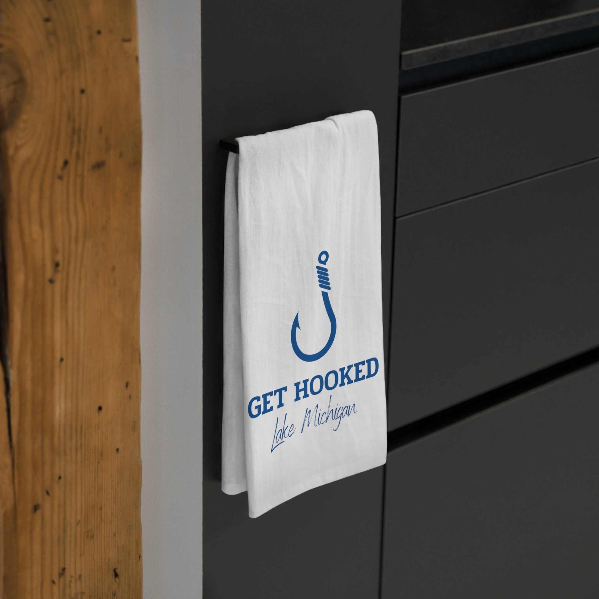 Hooked-Lake Michigan-Tea Towel hanging in kitchen, 100% cotton, blue hook design.